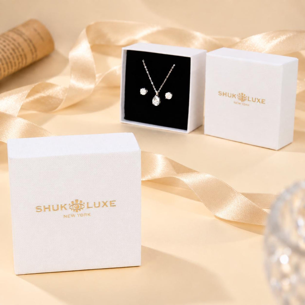 Closed and open SHUKLUXE gift boxes